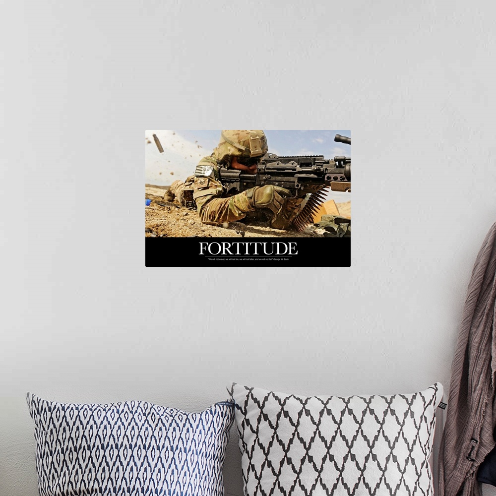 A bohemian room featuring Inspirational poster with the image of a soldier on the ground shooting a gun with shells flying ...