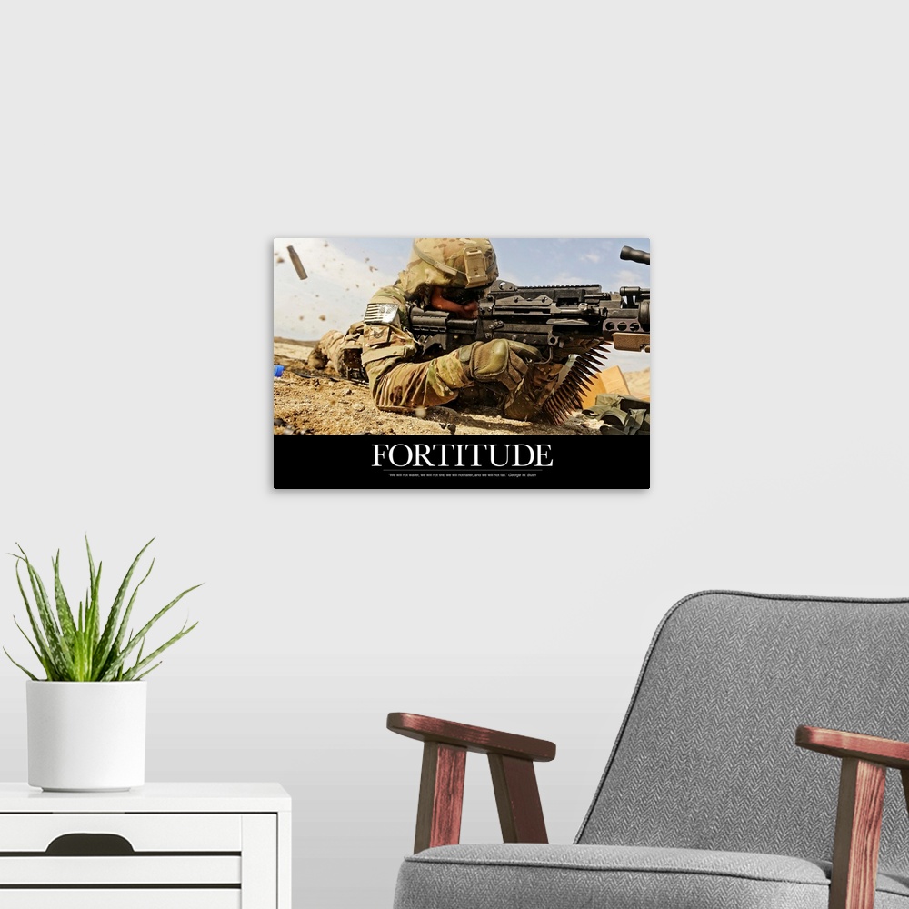 A modern room featuring Inspirational poster with the image of a soldier on the ground shooting a gun with shells flying ...