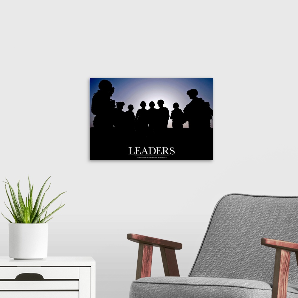 A modern room featuring Large photo of the silhouette of soldiers standing against a clear sky with text at the bottom.