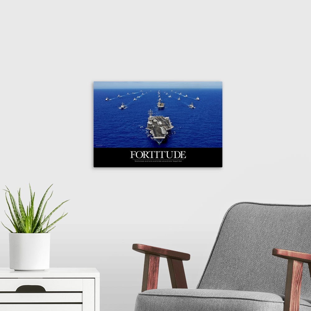 A modern room featuring A big piece that is a picture of the navy fleet in the open ocean with the word "Fortitude" below...