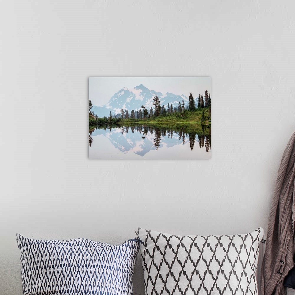 A bohemian room featuring Mount Shuksan's Peak is reflected in Picture Lake near Mount Shuksan, Washington.