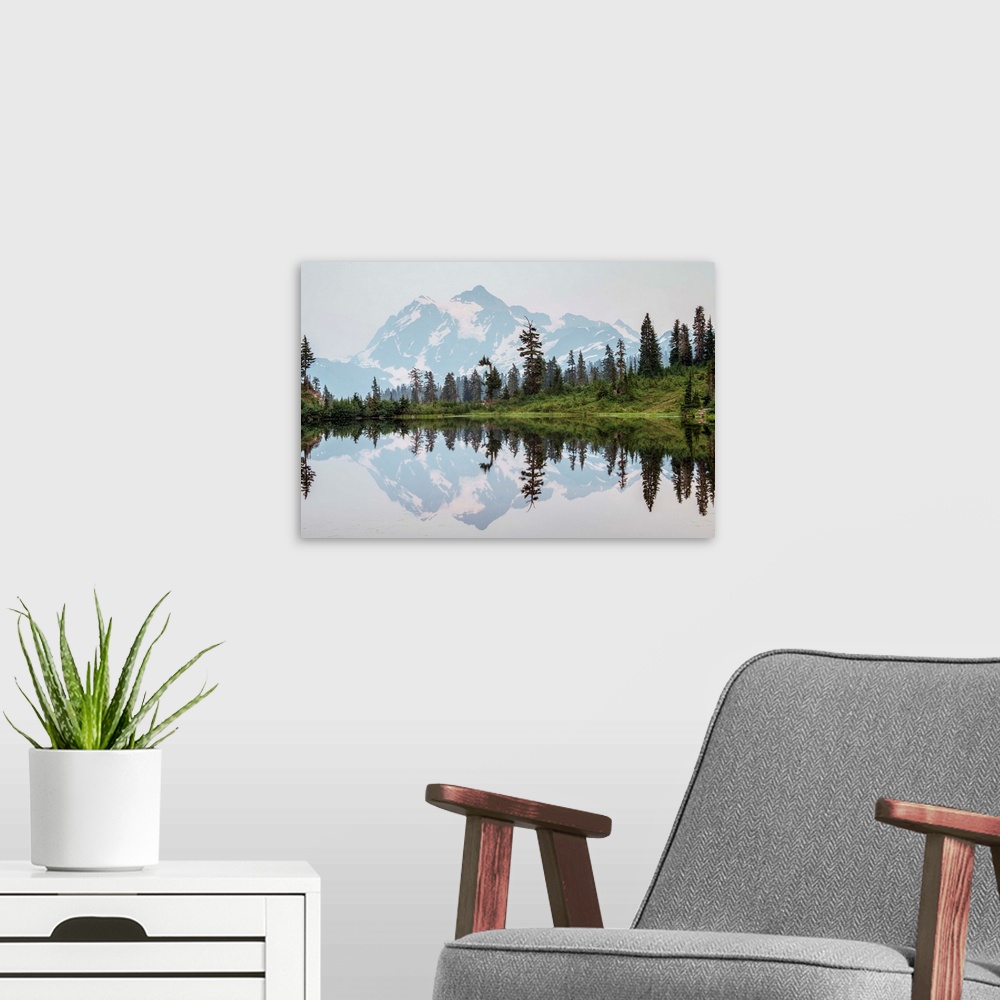 A modern room featuring Mount Shuksan's Peak is reflected in Picture Lake near Mount Shuksan, Washington.