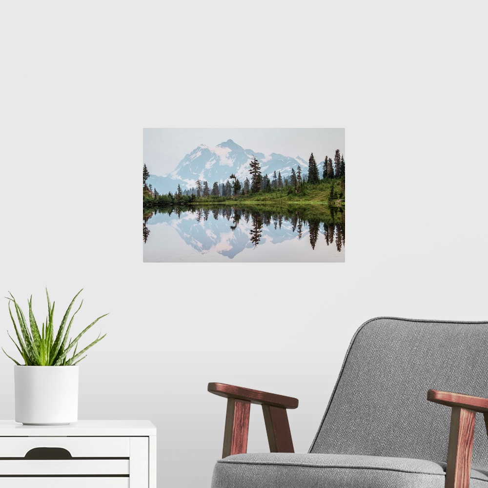 A modern room featuring Mount Shuksan's Peak is reflected in Picture Lake near Mount Shuksan, Washington.