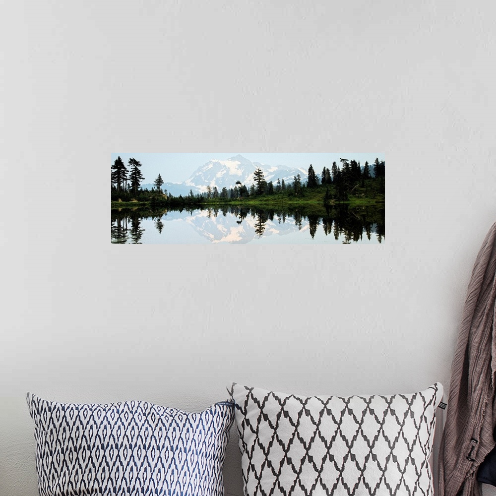A bohemian room featuring Panoramic photograph of Mt. Shuksan reflecting into Picture Lake around sunset.