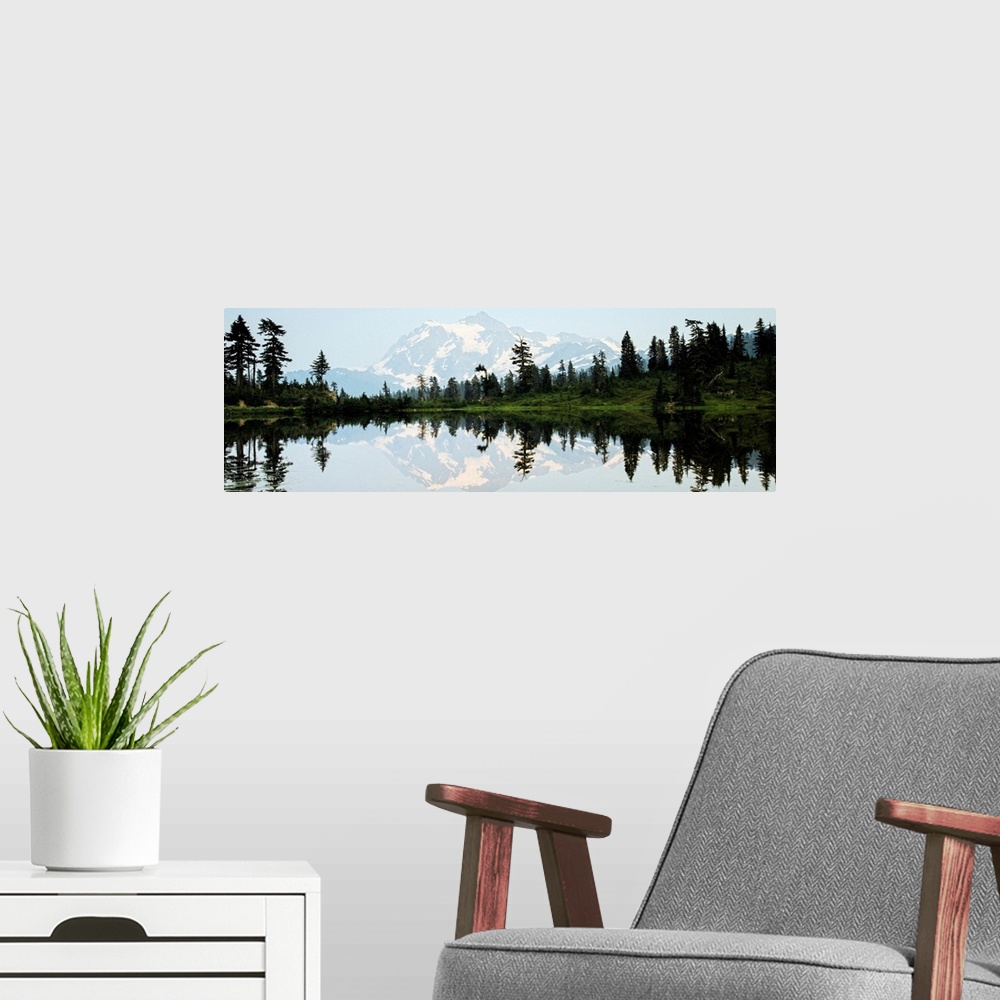 A modern room featuring Panoramic photograph of Mt. Shuksan reflecting into Picture Lake around sunset.