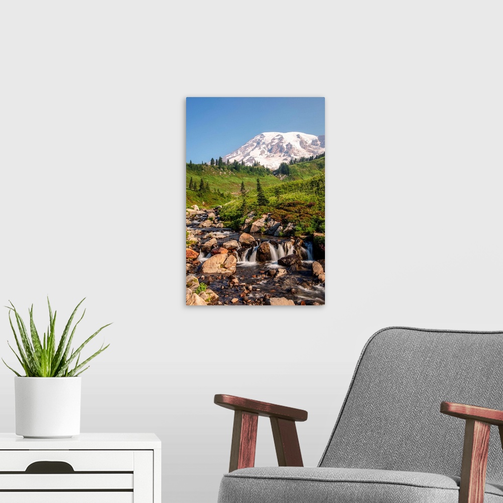 A modern room featuring View of a tranquil waterfall with Mount Rainier peak in the background, Mount Rainier National Pa...