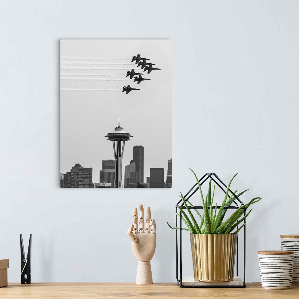 A bohemian room featuring Black and white photograph of Navy jets flying over the Seattle Space Needle.