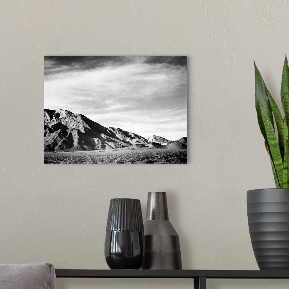 A modern room featuring Near Death Valley, panorama of mountains.