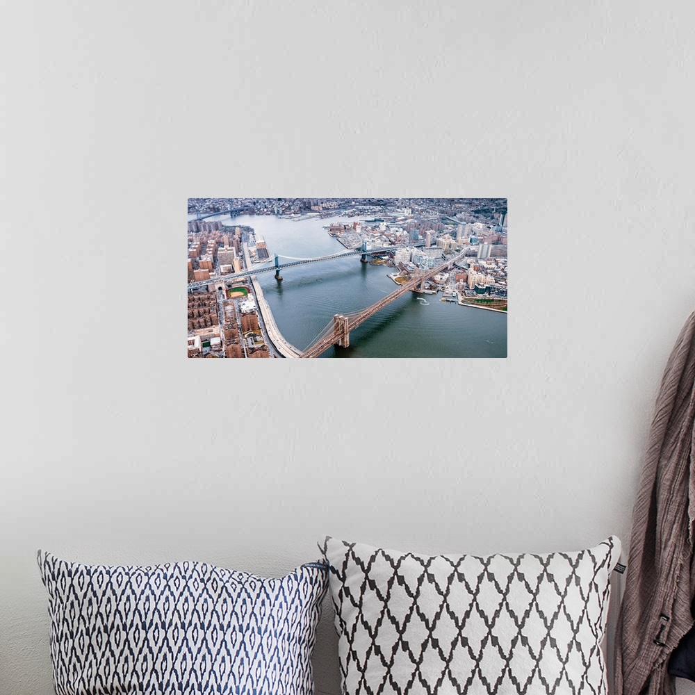 A bohemian room featuring Aerial view of the Brooklyn and Manhattan Bridges in New York City.
