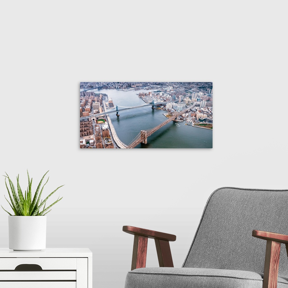 A modern room featuring Aerial view of the Brooklyn and Manhattan Bridges in New York City.