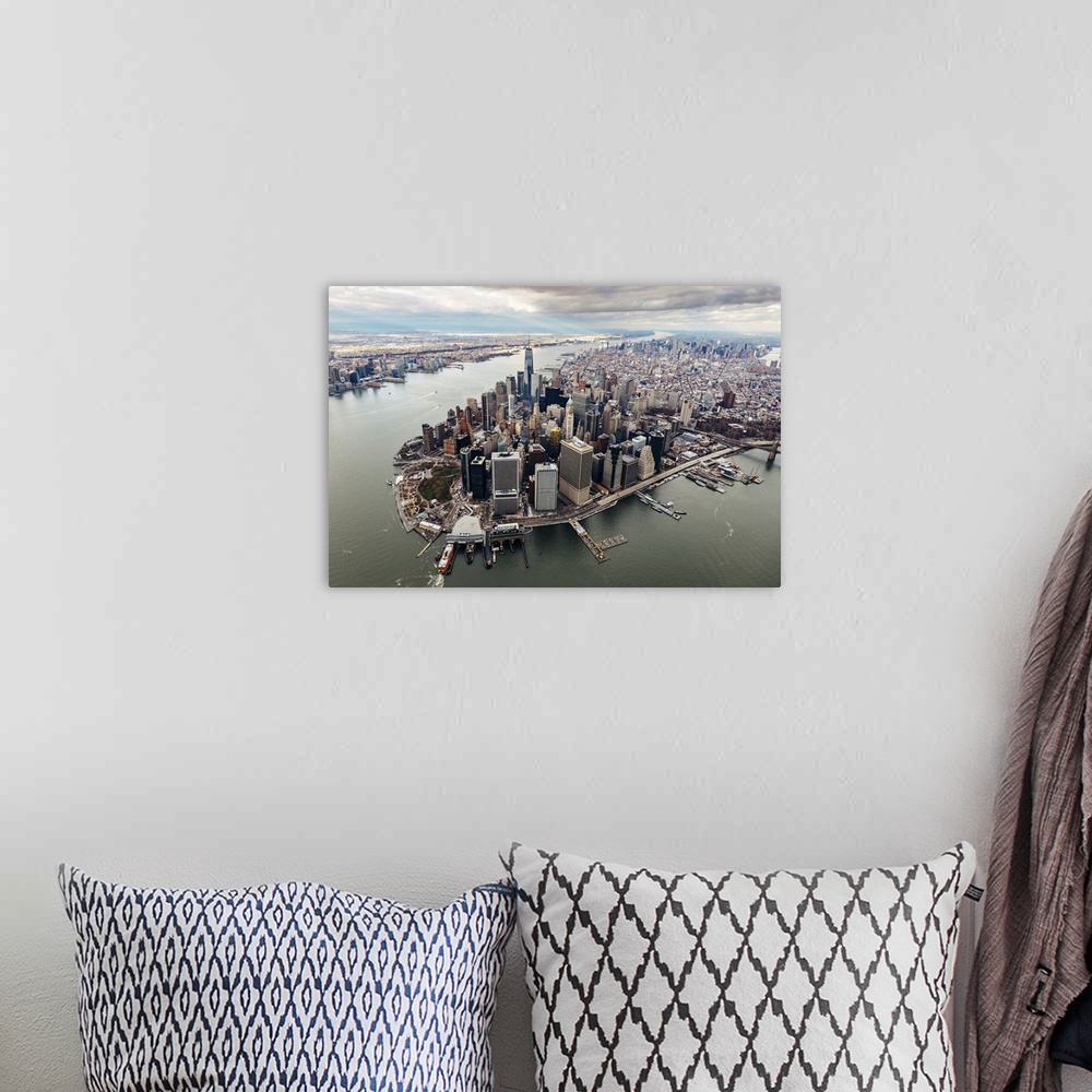A bohemian room featuring Aerial view of the skyscrapers in the Financial District at the edge of the water in New York City.