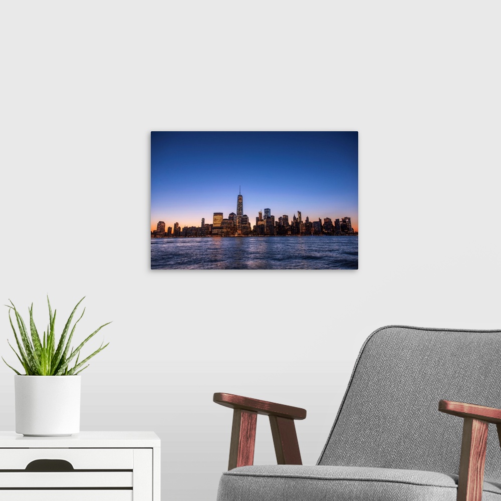 A modern room featuring The New York City Skyline, New York, seen in the morning.