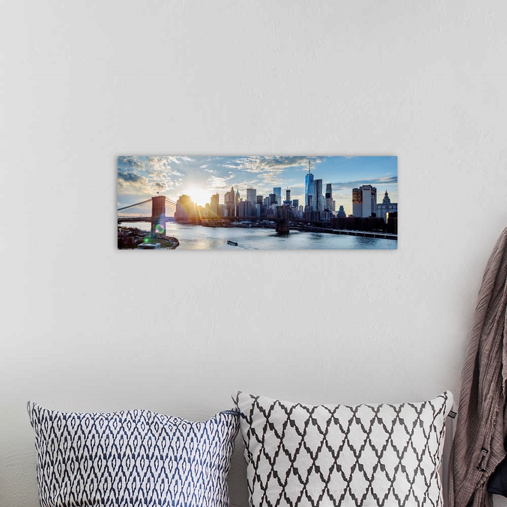 A bohemian room featuring View of the New York City skyline as the sun setting with the Brooklyn Bridge, from across the wa...