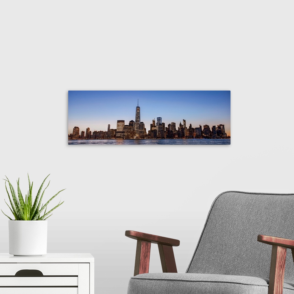 A modern room featuring Panoramic view of the New York City skyline over Manhattan in the morning.