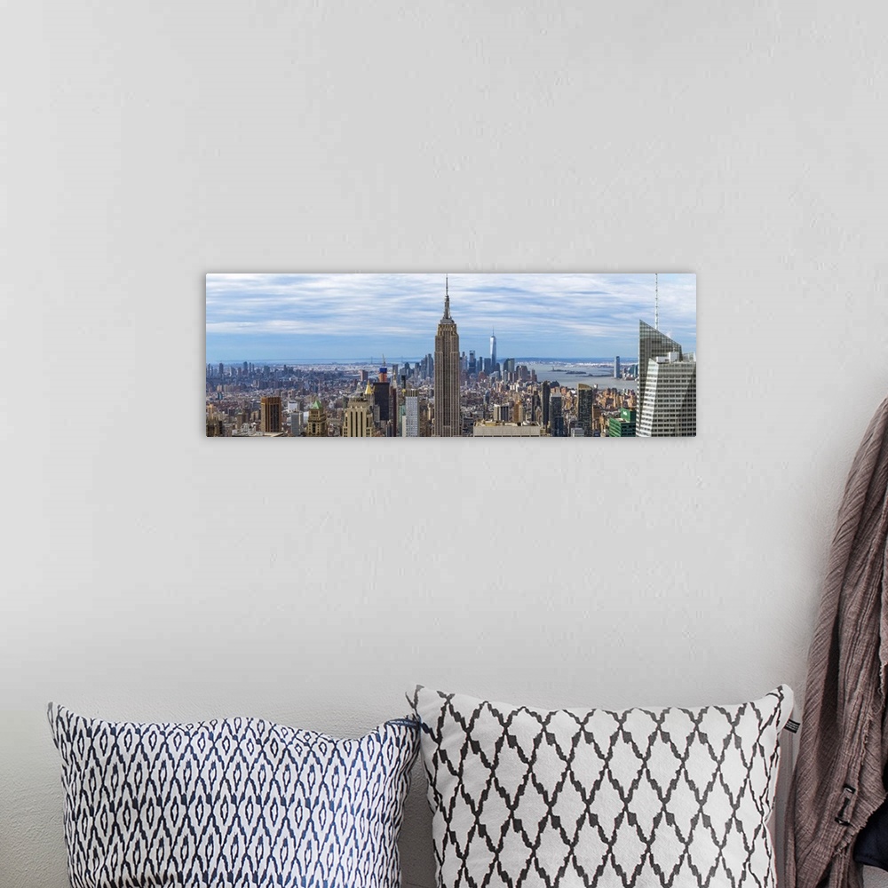 A bohemian room featuring Panoramic view of New York City with the Empire State Building in the center.