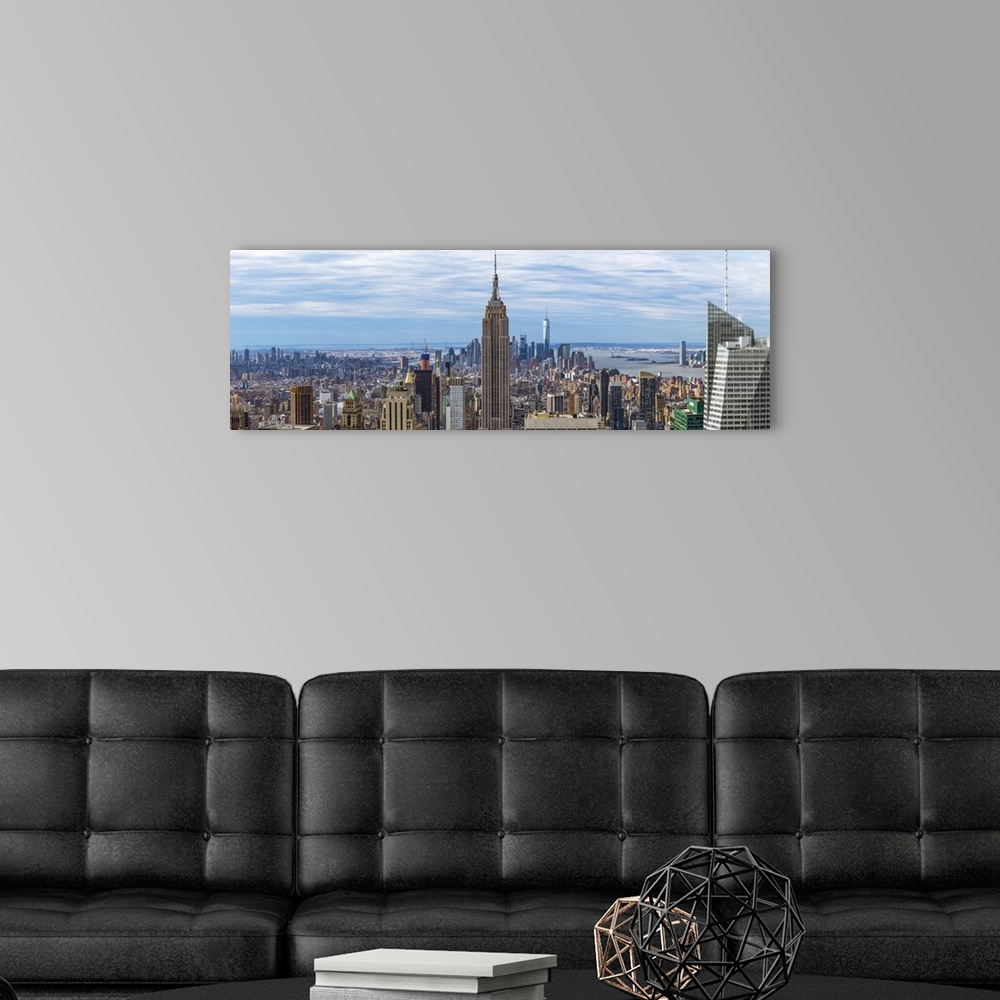 A modern room featuring Panoramic view of New York City with the Empire State Building in the center.