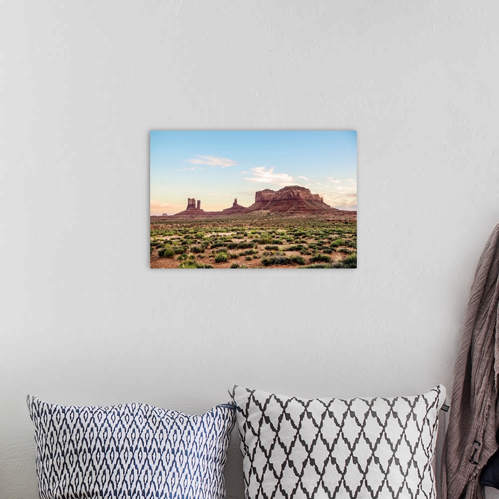 A bohemian room featuring North view of Brighams Tomb and Stagecoach rock formation in Monument Valley, Utah.