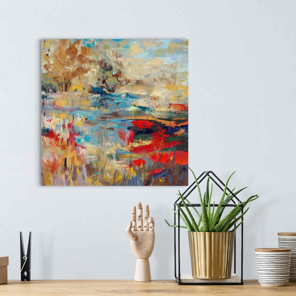 A bohemian room featuring Abstract landscape painting of a creek with hints of poppy red and bright, mustard yellows.