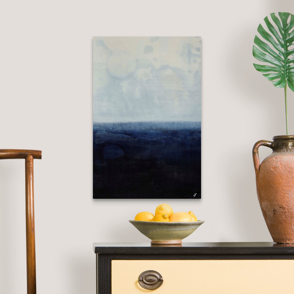 A traditional room featuring Simplistic abstracted seascape of a field of gray-blue overtop a field of navy.