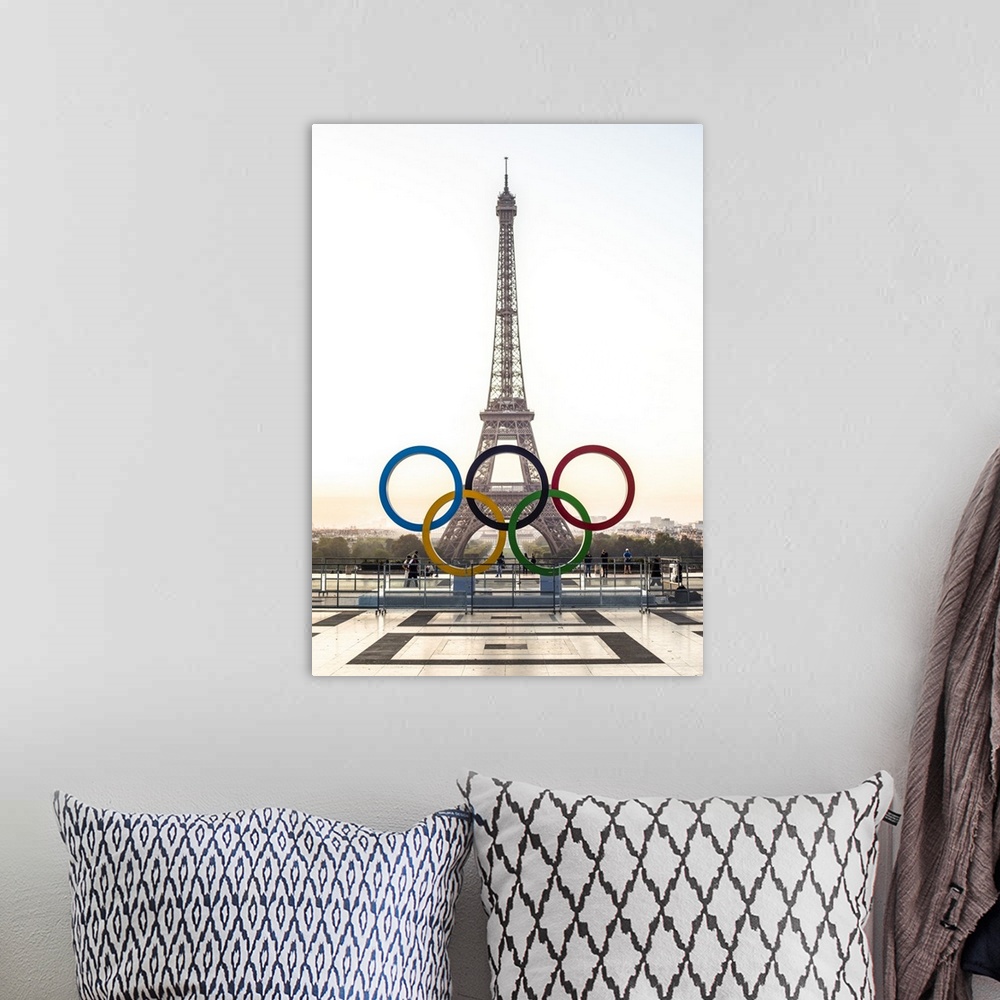 A bohemian room featuring Photograph of the Eiffel Tower at sunset with the Olympic Rings in front.