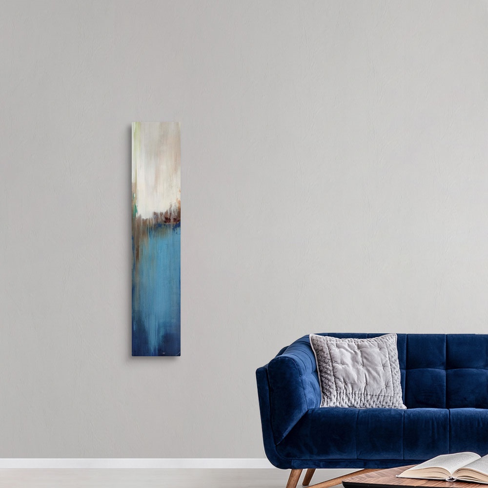 A modern room featuring Abstract painting with a composition of varying shades of blue, cool gray, and tan divided in thr...