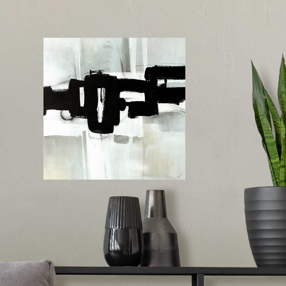 A modern room featuring Contemporary abstract painting of interlocking black shapes over a gray background.