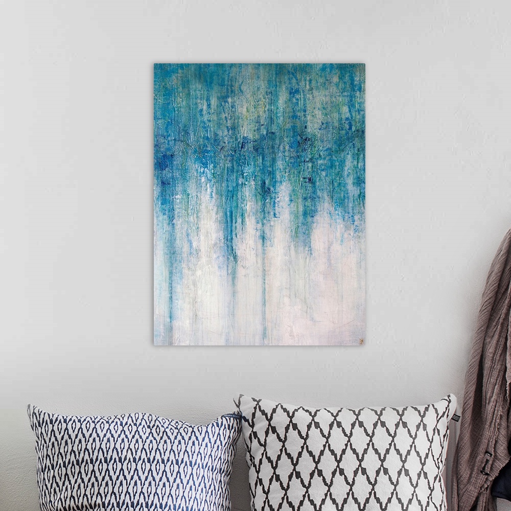 A bohemian room featuring Abstract artwork that has shades of blue color at the top that drip down toward the bottom which ...