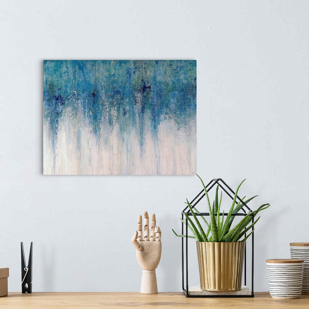 A bohemian room featuring Abstract artwork with different shades of blue toward the top of the print fading down to an almo...