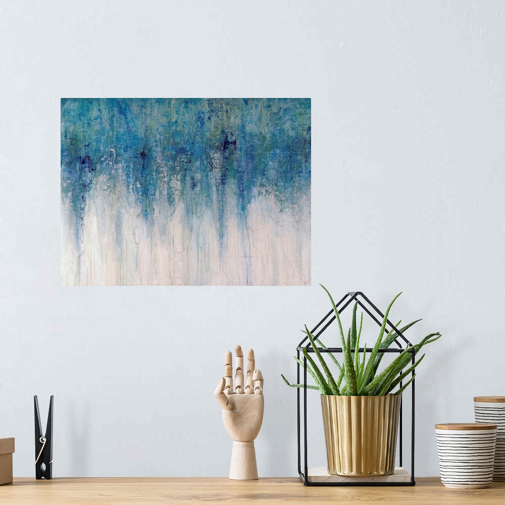 A bohemian room featuring Abstract artwork with different shades of blue toward the top of the print fading down to an almo...