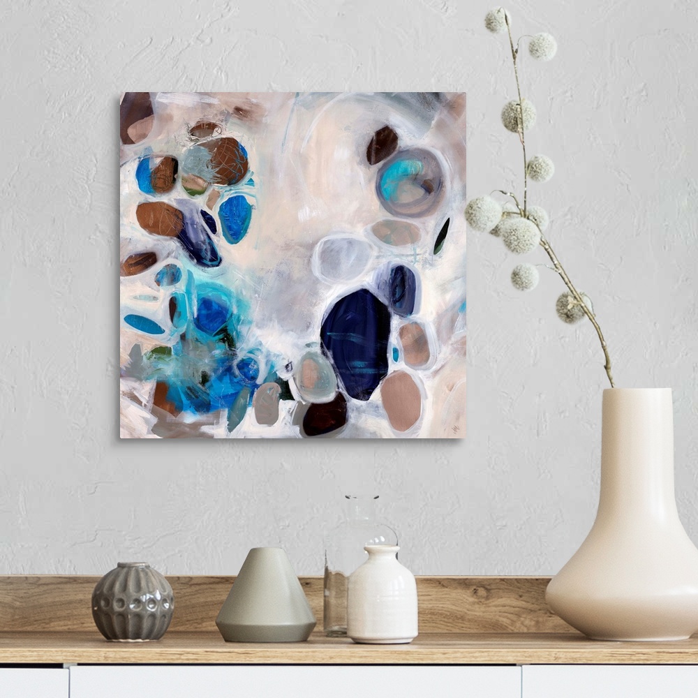 A farmhouse room featuring Contemporary abstract painting of stone-like shapes in blues and browns over a neutral background.