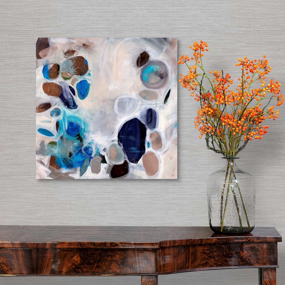 A traditional room featuring Contemporary abstract painting of stone-like shapes in blues and browns over a neutral background.
