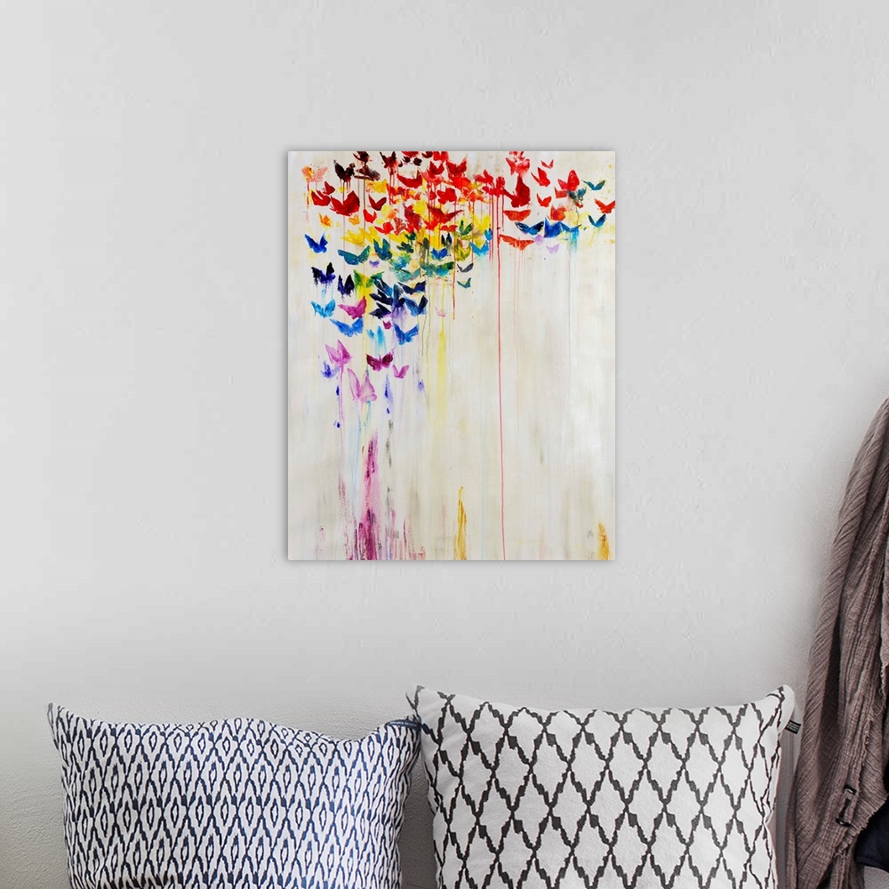 A bohemian room featuring A rainbow of dripping painted butterflies against a white background.