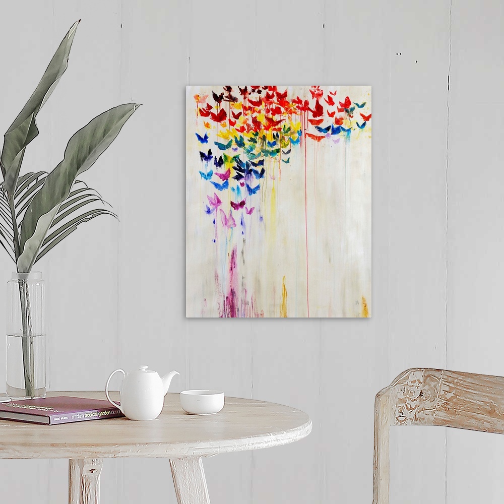 A farmhouse room featuring A rainbow of dripping painted butterflies against a white background.