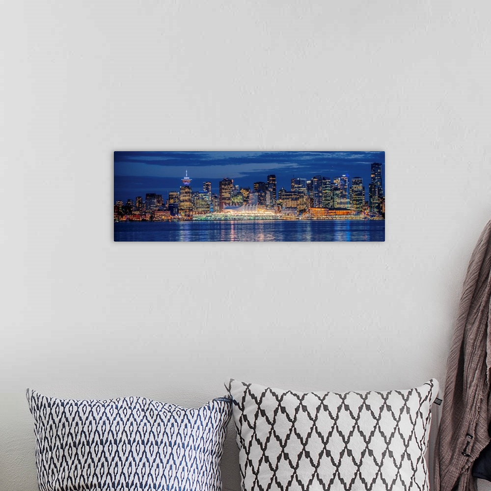 A bohemian room featuring Panorama of Vancouver skyline at night in British Columbia, Canada.