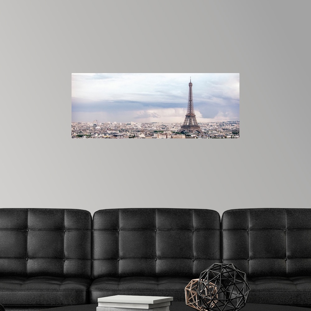 A modern room featuring Panoramic photograph of the city of Paris highlighting the Eiffel Tower.