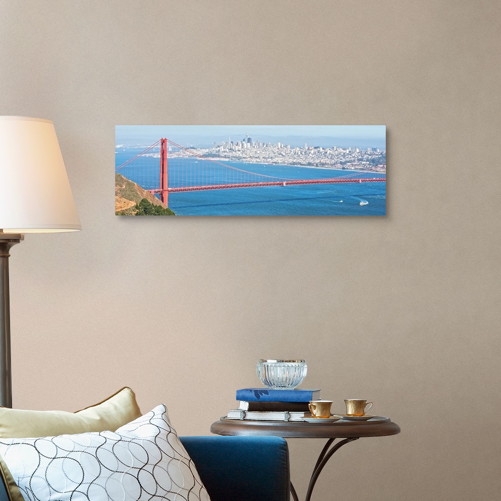 A traditional room featuring Panoramic photograph of the bright red Golden Gate Bridge with San Francisco in the background.