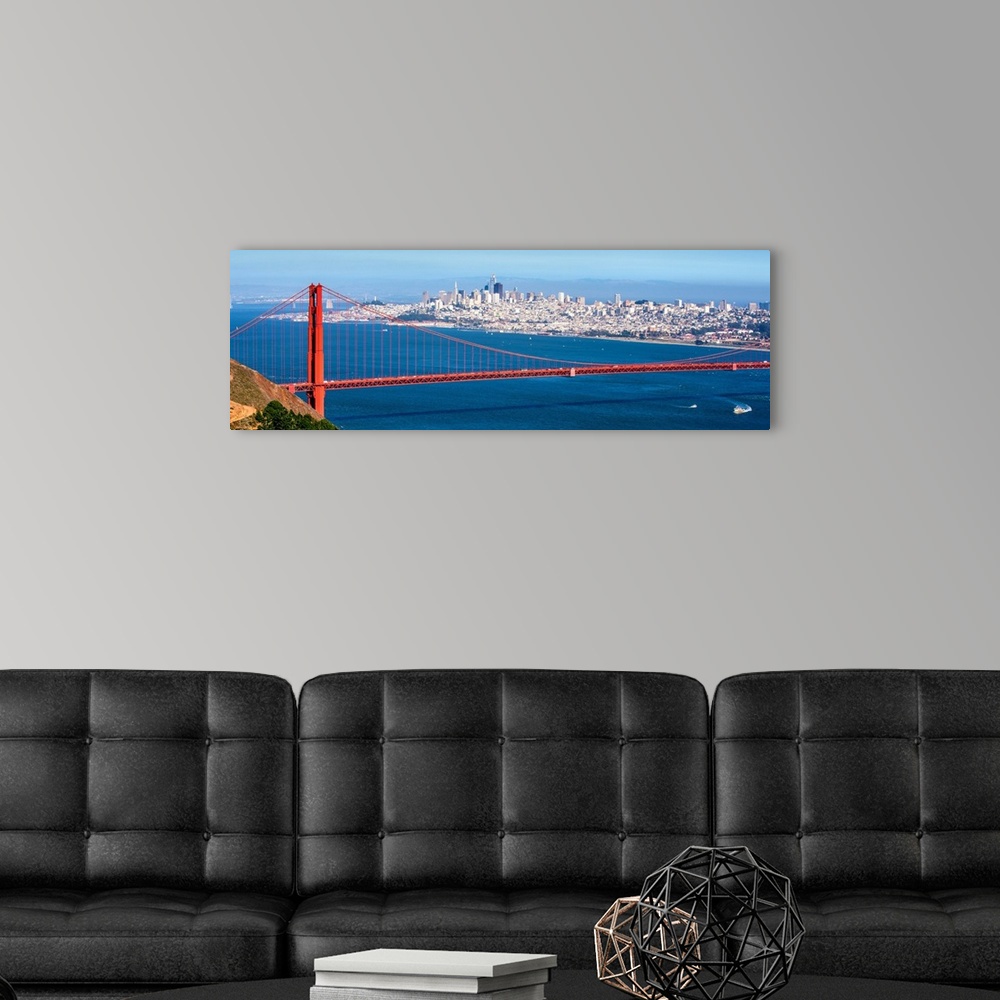 A modern room featuring Panoramic photograph of the Golden Gate Bridge with San Francisco's skyscrapers in the background.