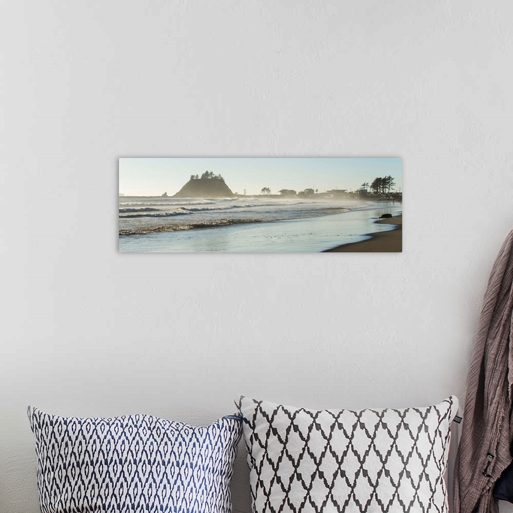 A bohemian room featuring Panoramic landscape photograph of the La Push Beach shore with misty rock cliffs in the background.
