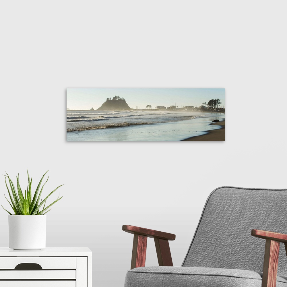 A modern room featuring Panoramic landscape photograph of the La Push Beach shore with misty rock cliffs in the background.