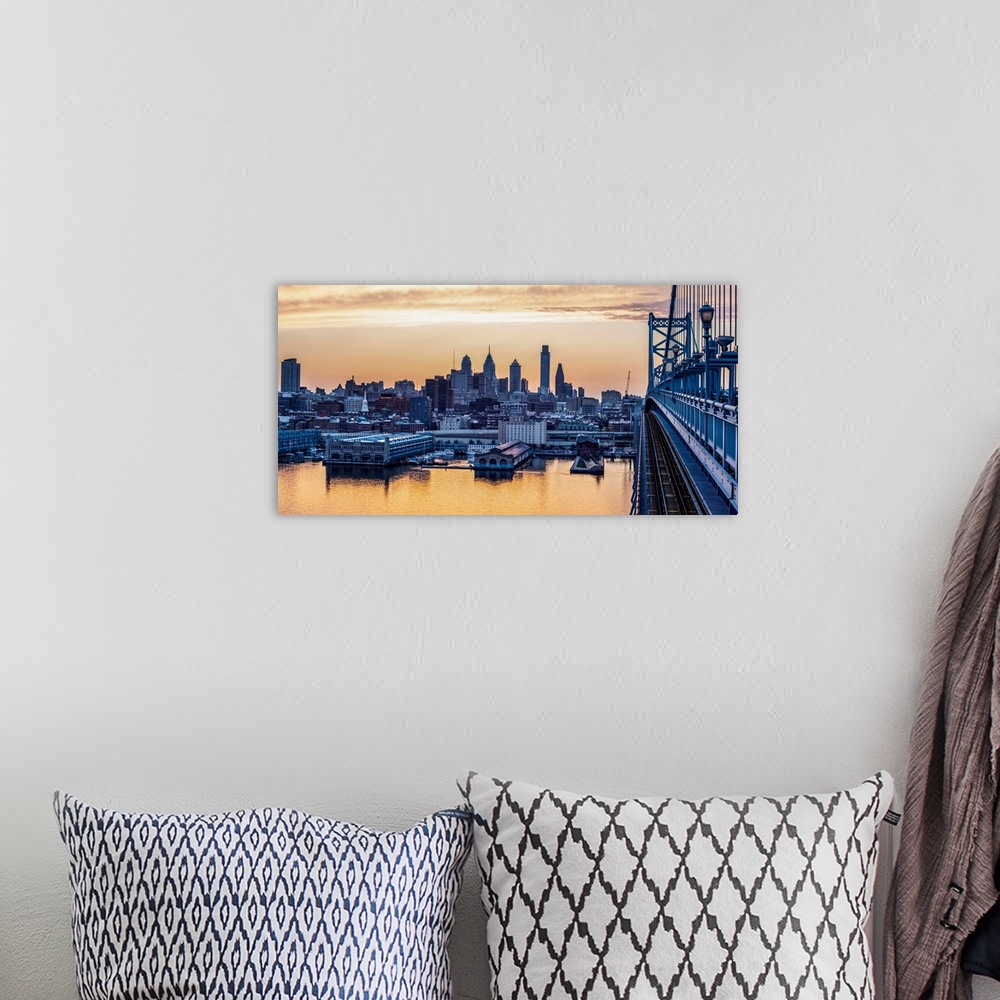 A bohemian room featuring View of Philadelphia's city skyline against a dewy melon colored sky.