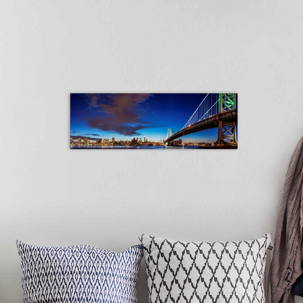 A bohemian room featuring Panoramic view of Philadelphia city skyline at night with Ben Franklin Bridge.