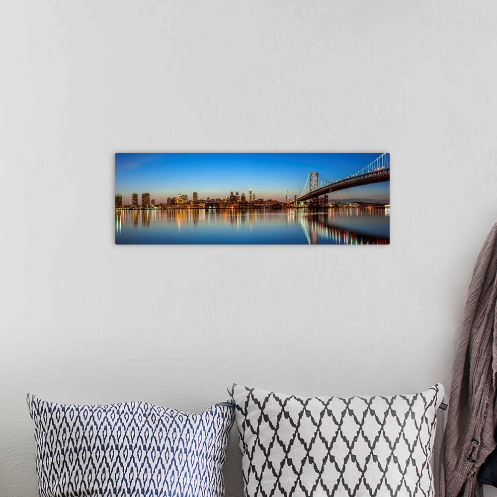 A bohemian room featuring Panoramic view of Philadelphia city skyline at sunset with Ben Franklin Bridge.