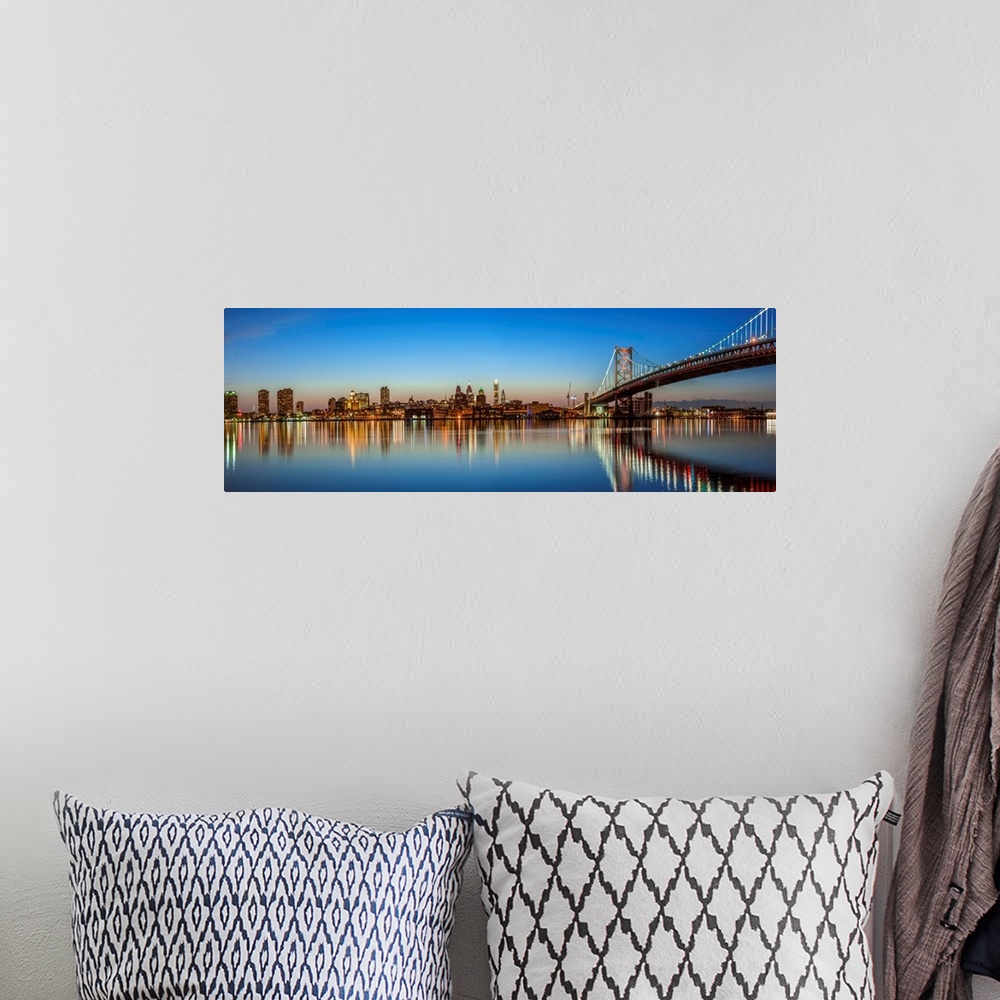 A bohemian room featuring Panoramic view of Philadelphia city skyline at sunset with Ben Franklin Bridge.