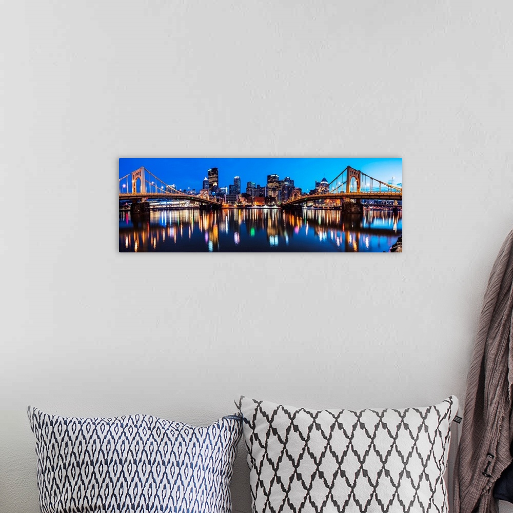 A bohemian room featuring Panoramic photo of downtown Pittsburgh at night with the Rachel Carson Bridge and the Andy Warhol...