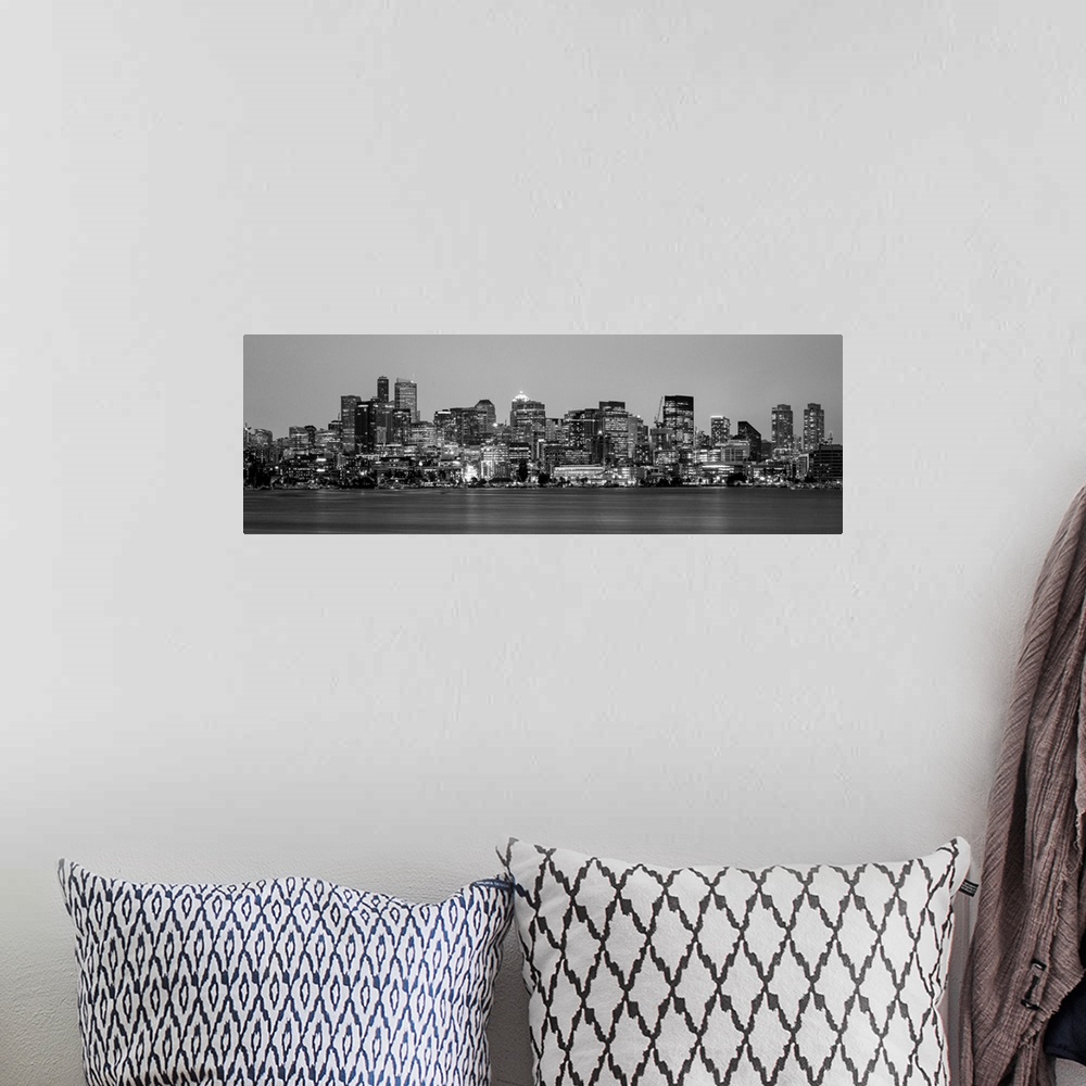 A bohemian room featuring Panoramic view of Seattle's city skyline at night, Washington.