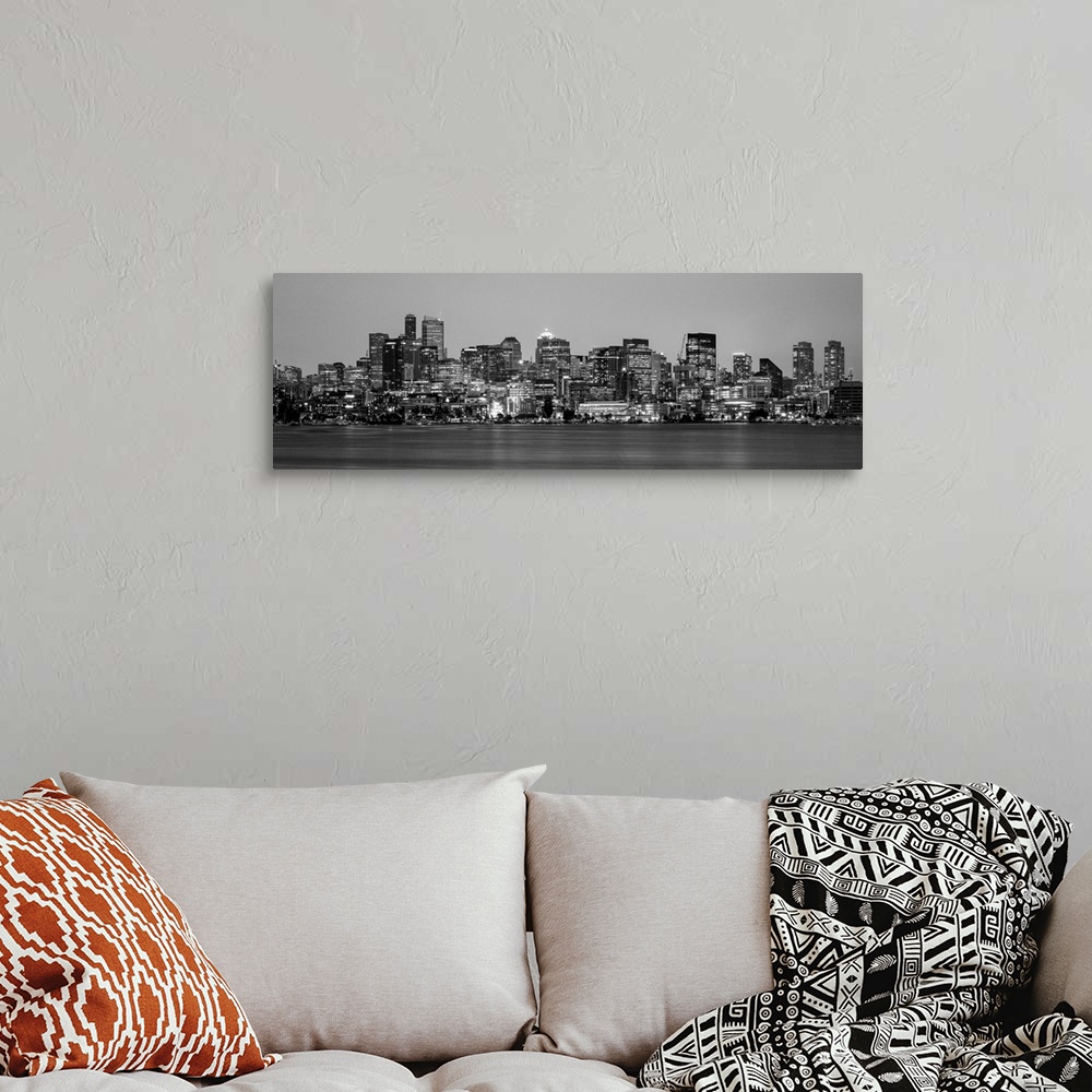 A bohemian room featuring Panoramic view of Seattle's city skyline at night, Washington.