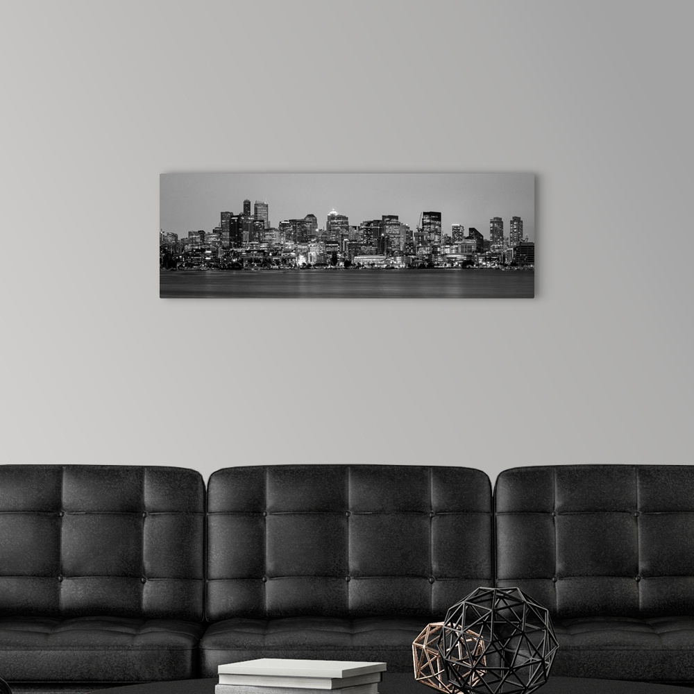 A modern room featuring Panoramic view of Seattle's city skyline at night, Washington.