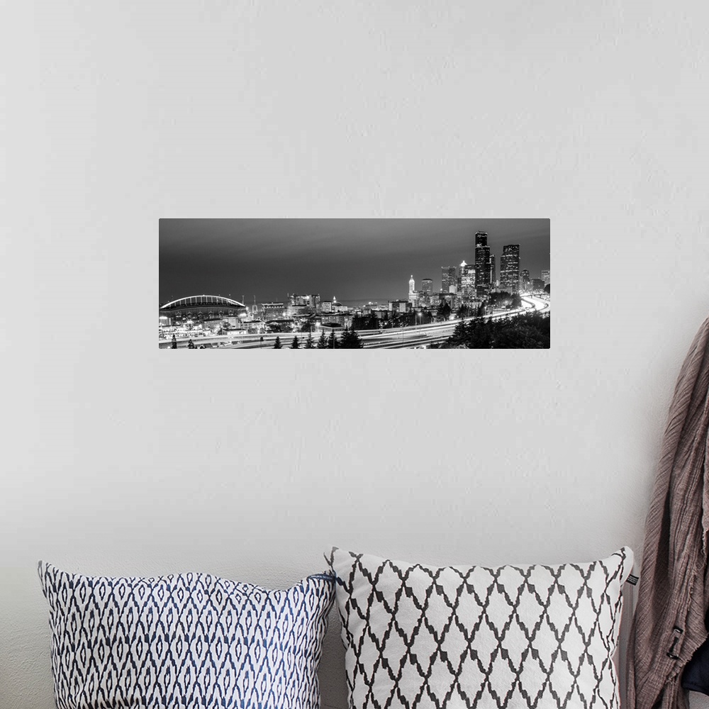 A bohemian room featuring Panoramic photograph of the Seattle skyline with the stadium on the left and light trails from tr...