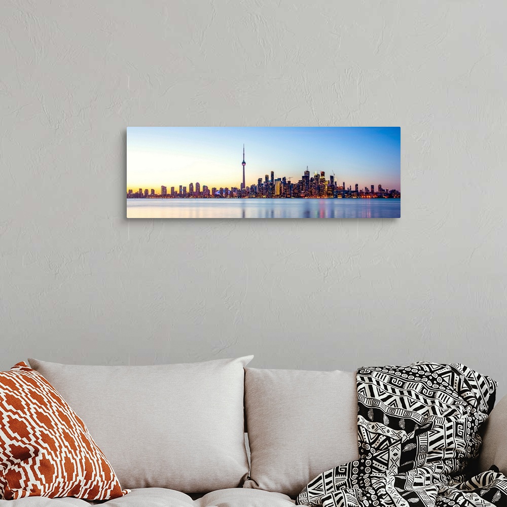 A bohemian room featuring Panoramic photo of Toronto city skyline at sunset, Ontario, Canada.