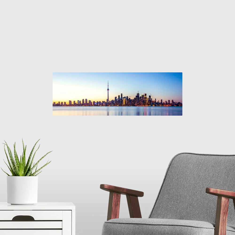 A modern room featuring Panoramic photo of Toronto city skyline at sunset, Ontario, Canada.